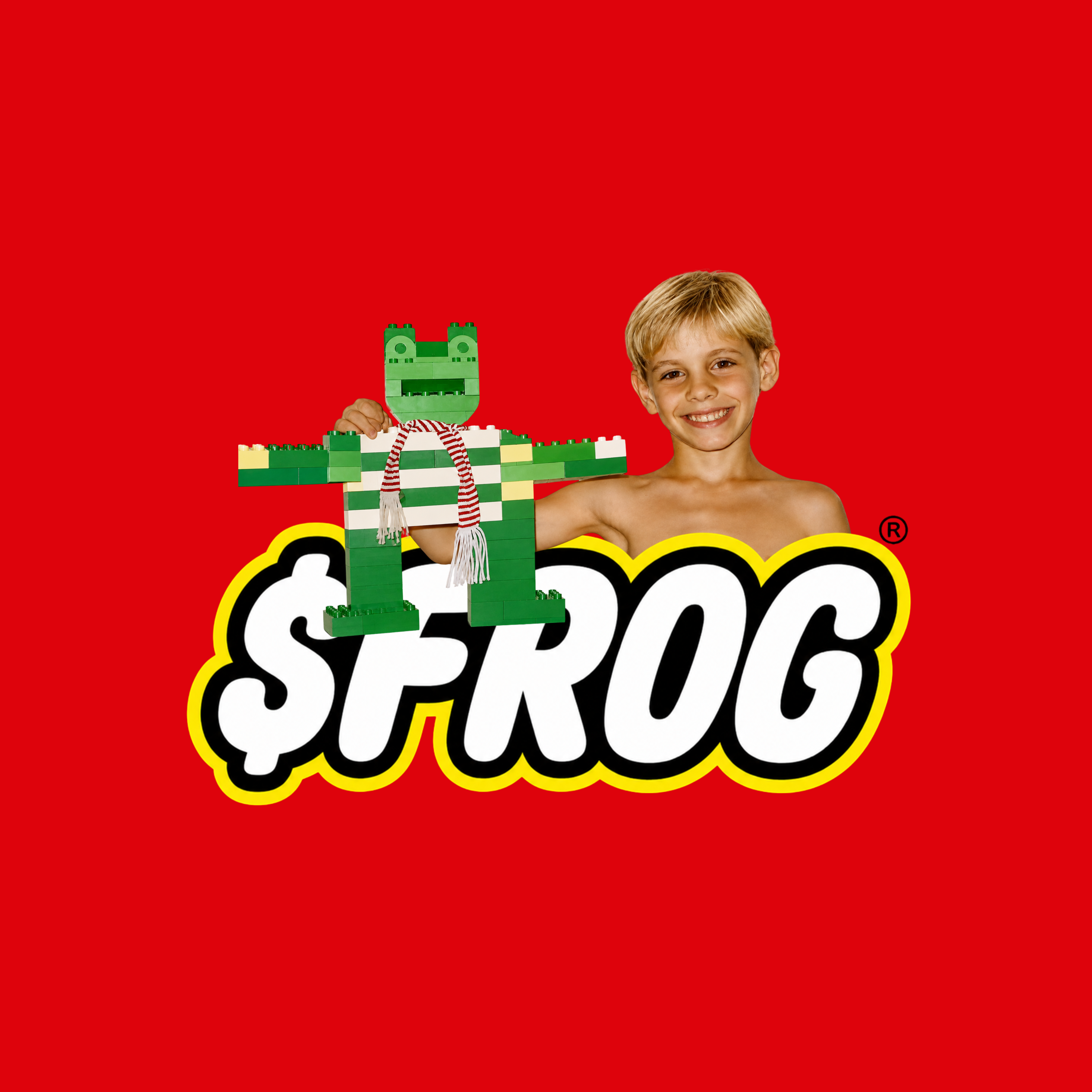 A young boy presenting the original green block-built frog against the red $FROG artwork